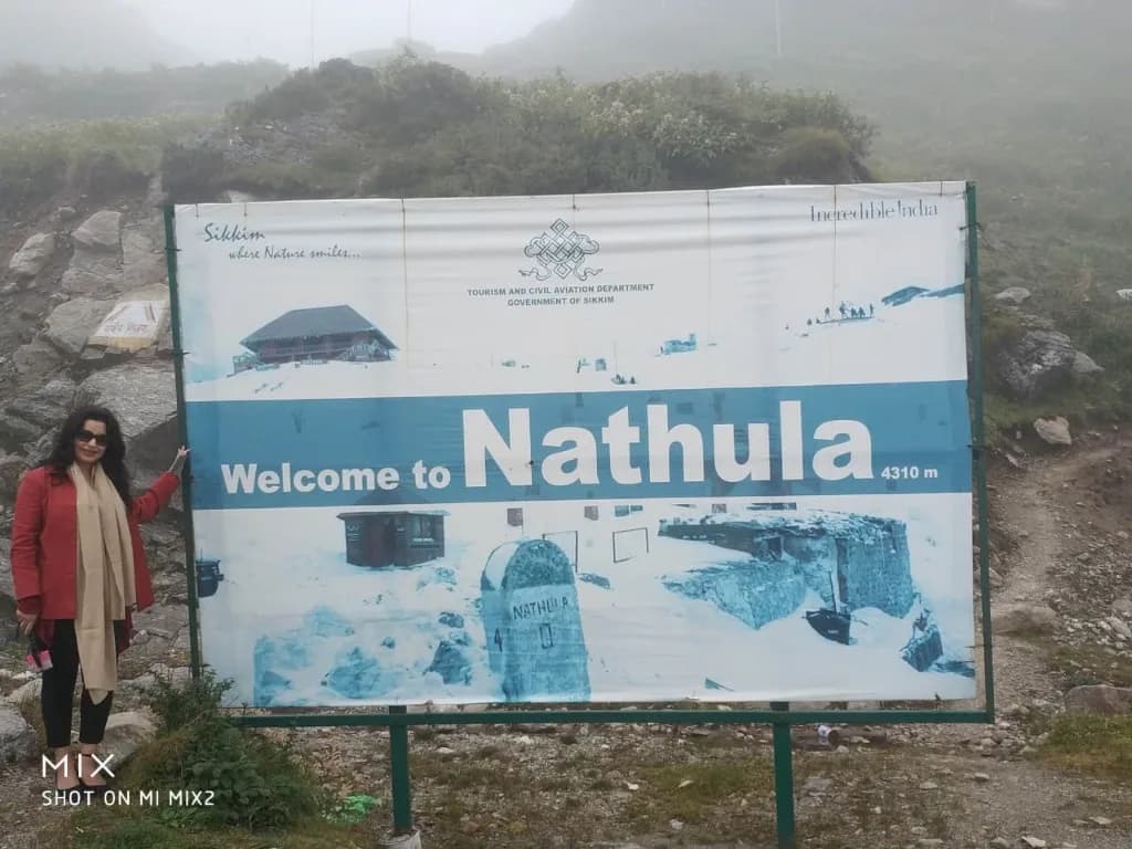 Traveler by Tourism Department Welcome to Nathula Pass 4310m signboard