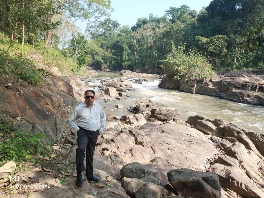 Exploring the rocky riverbed near Pobitora