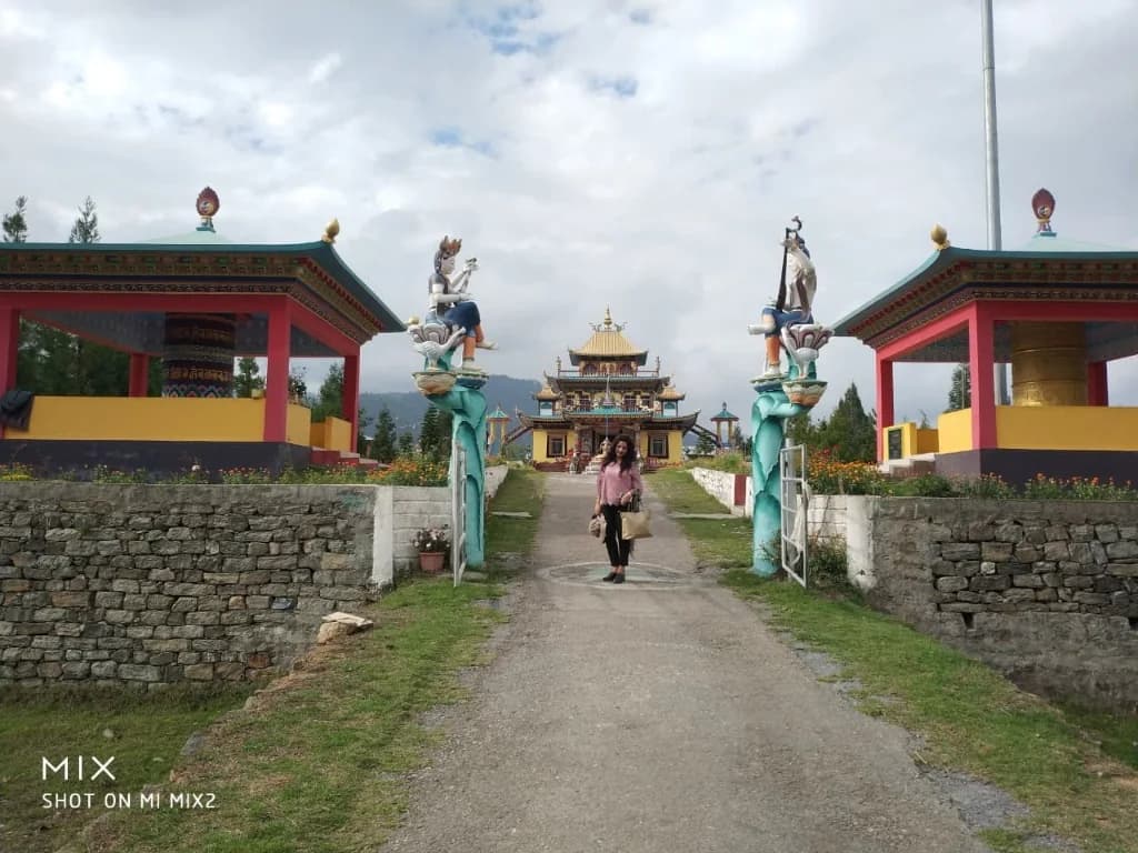 Entrance pathway flanked by prayer wheel pavilions leading to Chillipam Monastery