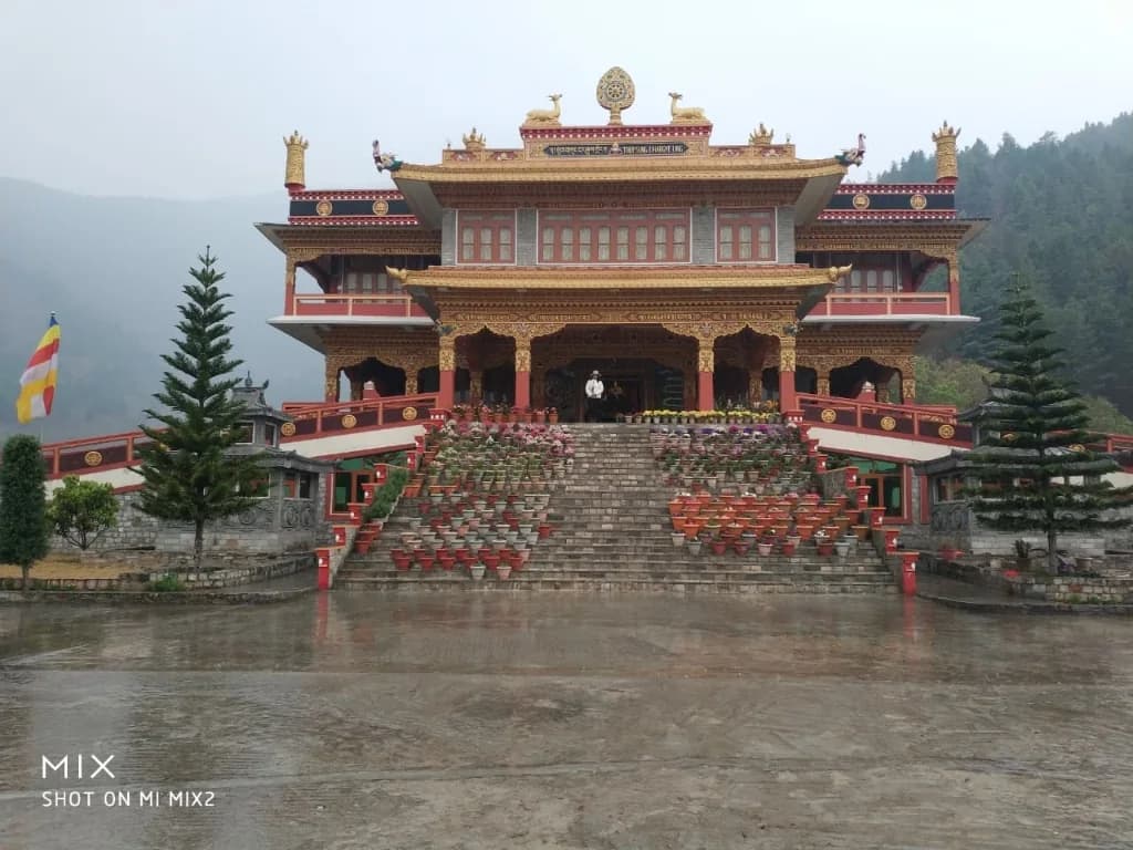 Grand flower-adorned staircase leading to Thupsung Dhargye Ling Monastery in Dirang