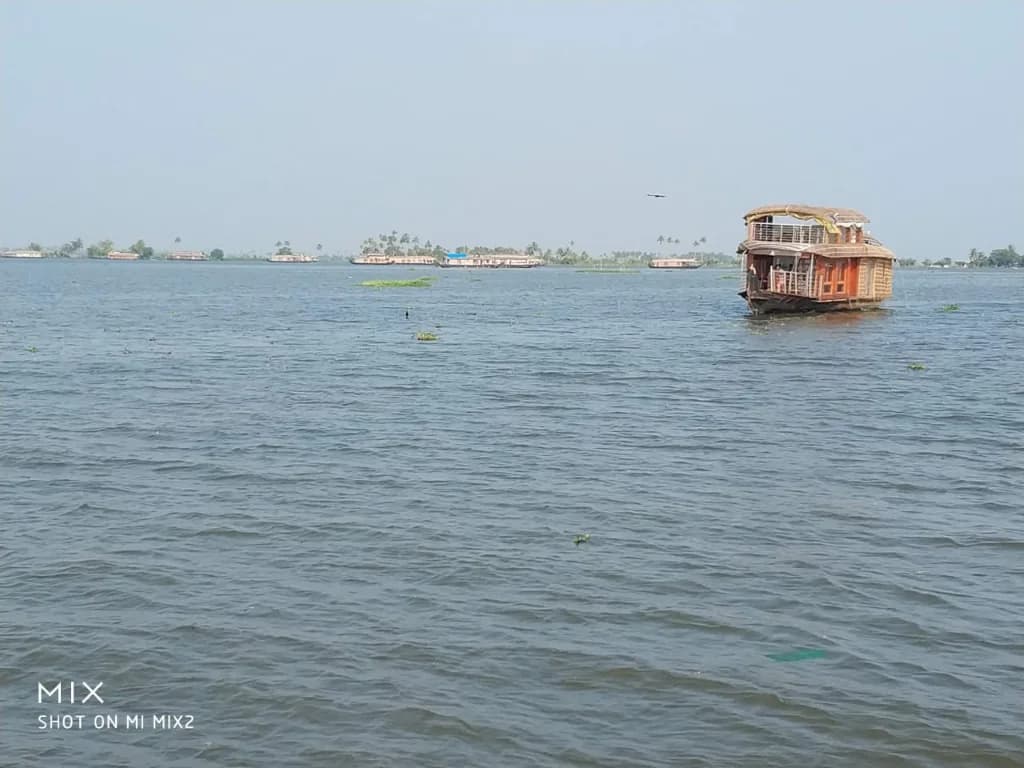 Kerala houseboat drifting through Kumarakom backwaters