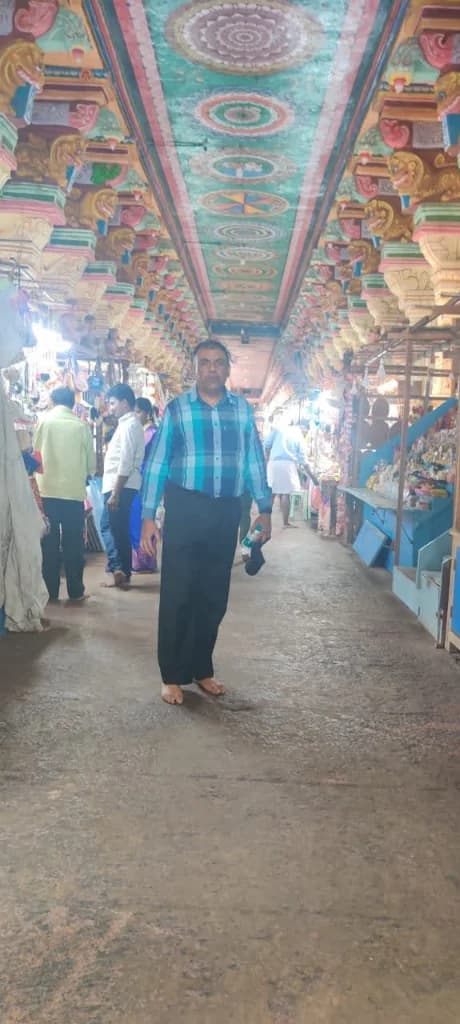 Intricately carved outer corridor and painted lotus ceilings at Ramanathaswamy Temple