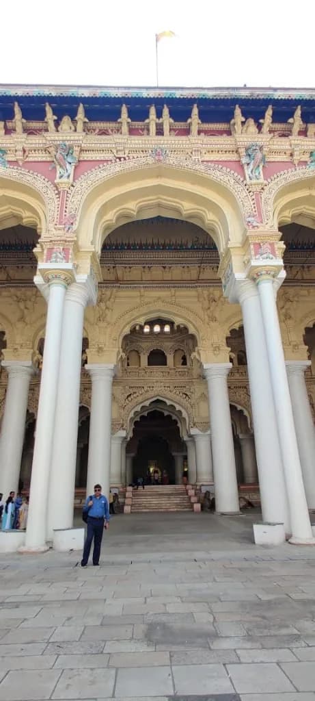 Ornate facade and colossal white pillars of Thirumalai Nayakkar Mahal