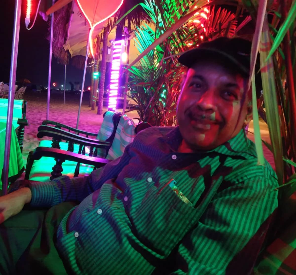 Beach shack host preparing dinner on a relaxed Goan evening