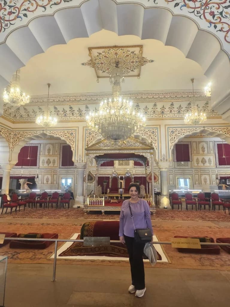 Ornate frescoed arches and chandelier in the Durbar Hall of Shahpura House, Jaipur