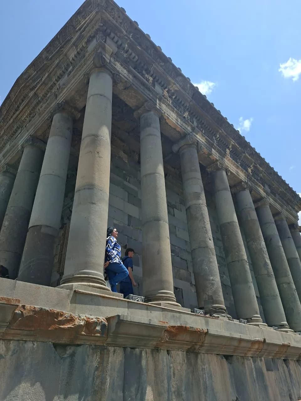Symmetrical massive stone columns supporting Garni Temple roof