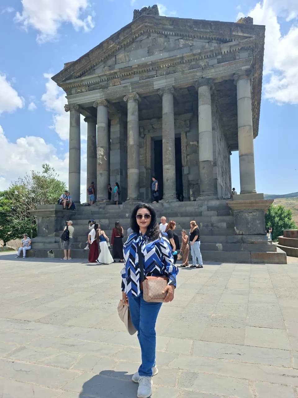 The iconic Garni Greco-Roman temple standing under blue sky