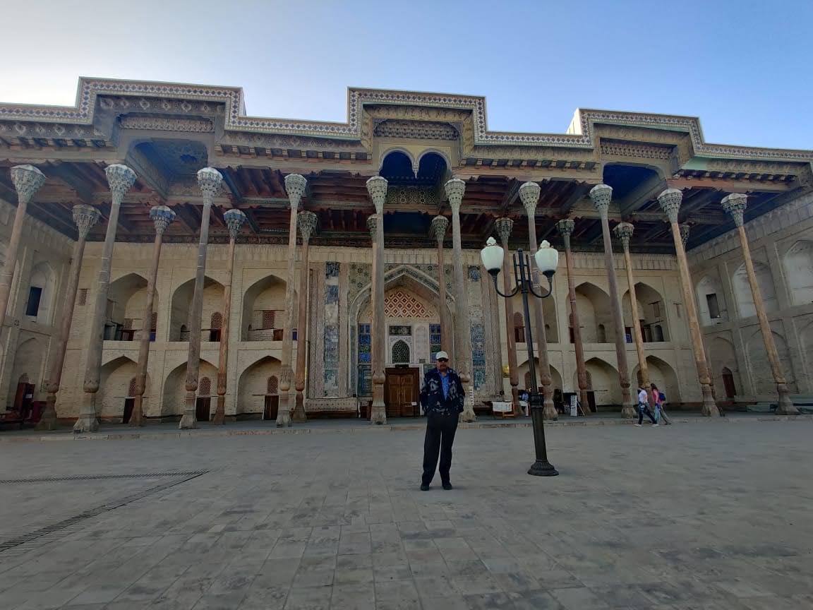 The carved wooden columns and facade of Bolo Hauz Mosque in Bukhara