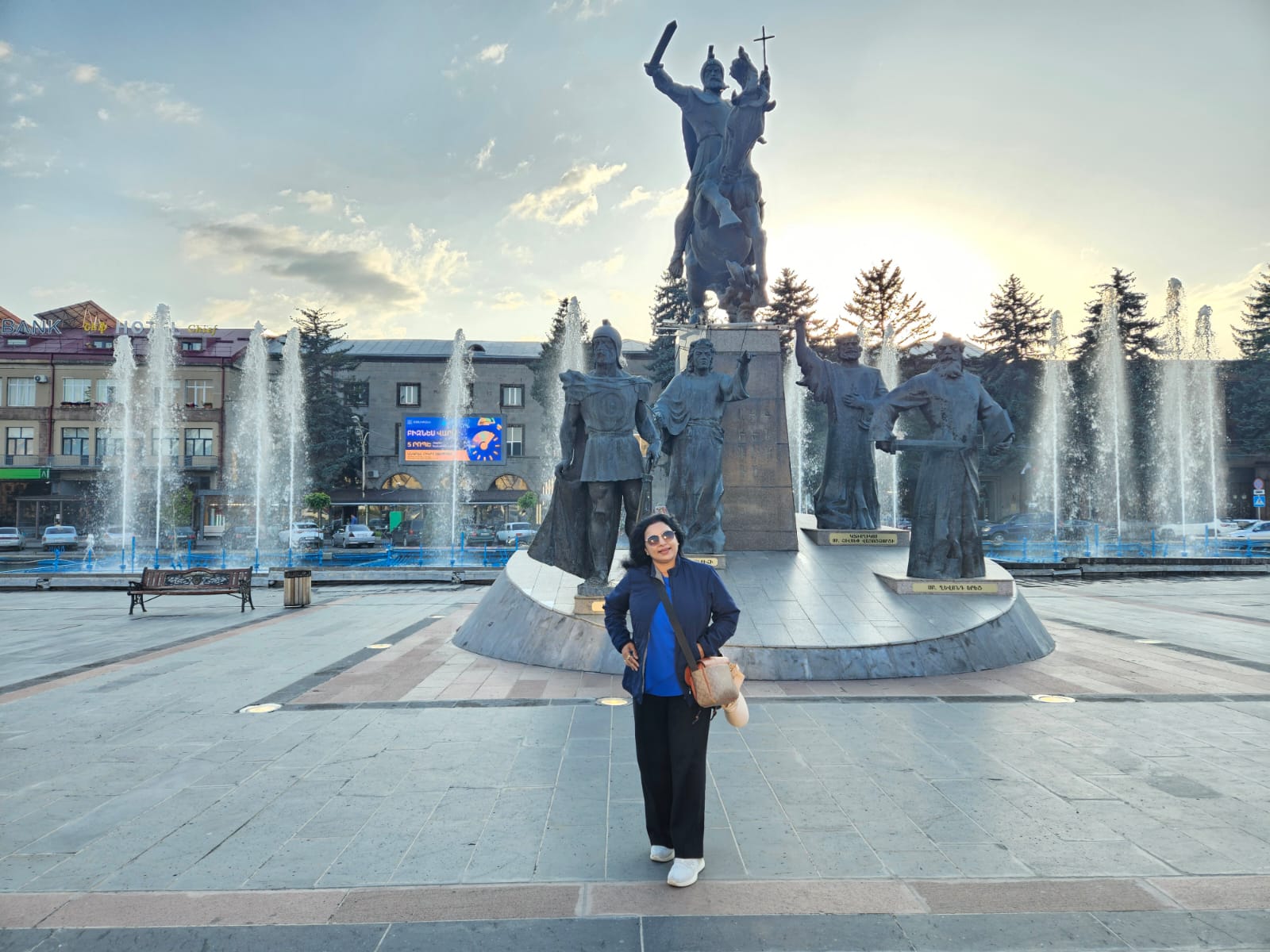 Main street view of historic black and orange stone buildings in Gyumri, Armenia