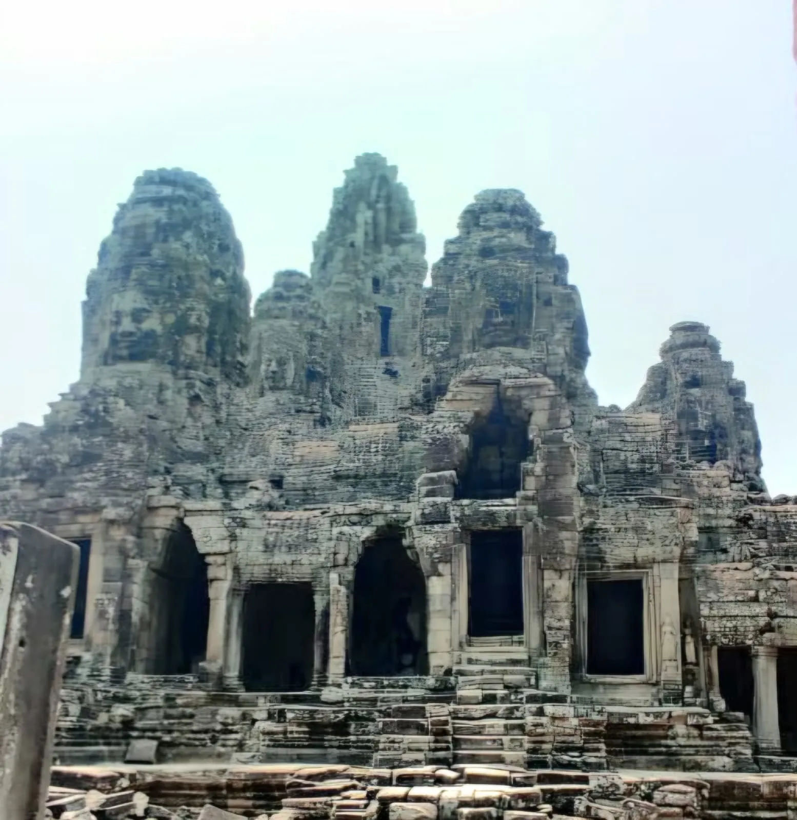 Complex stone structure with multiple faces at Bayon temple