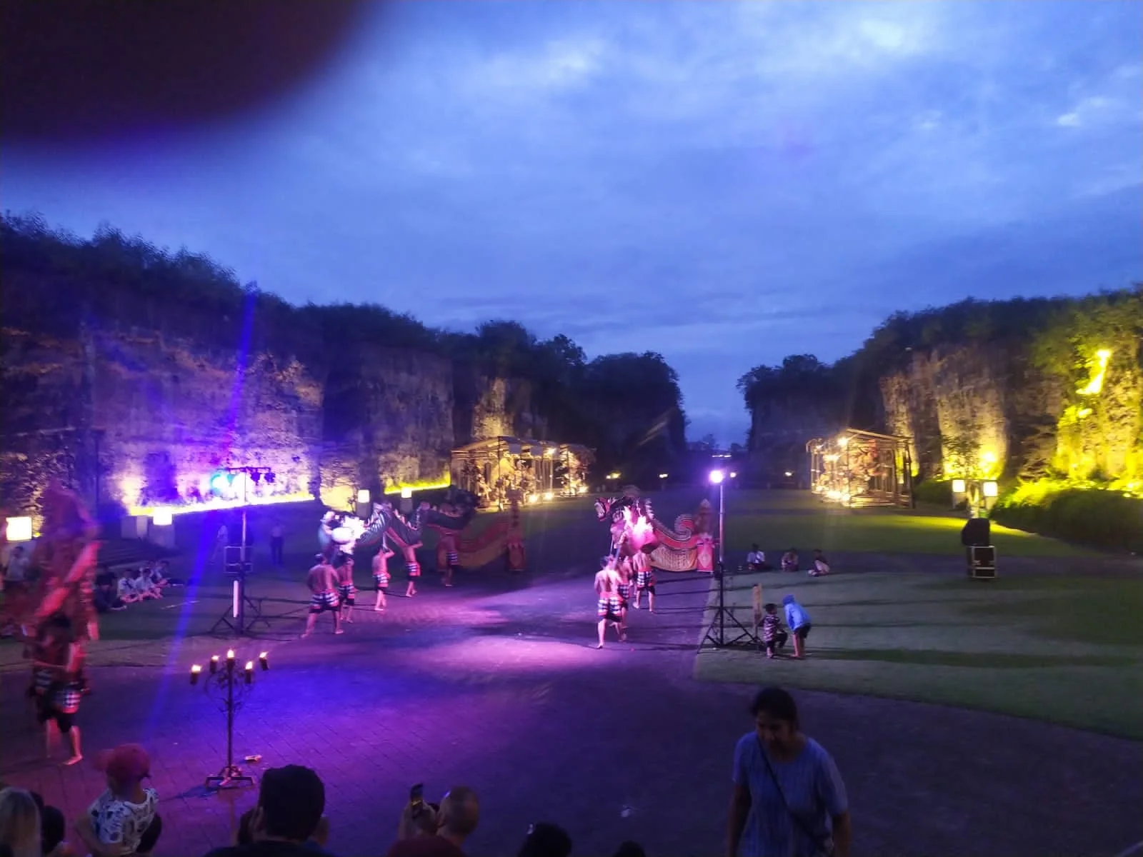 Dramatic twilight view of the amphitheater during the Kecak performance lit against cliffs
