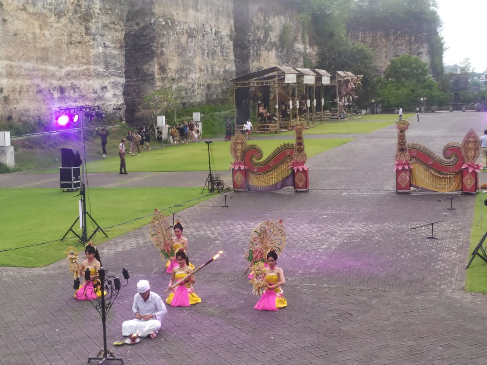 Opening ceremonial ritual of the Kecak dance with priest and dancers with golden fans