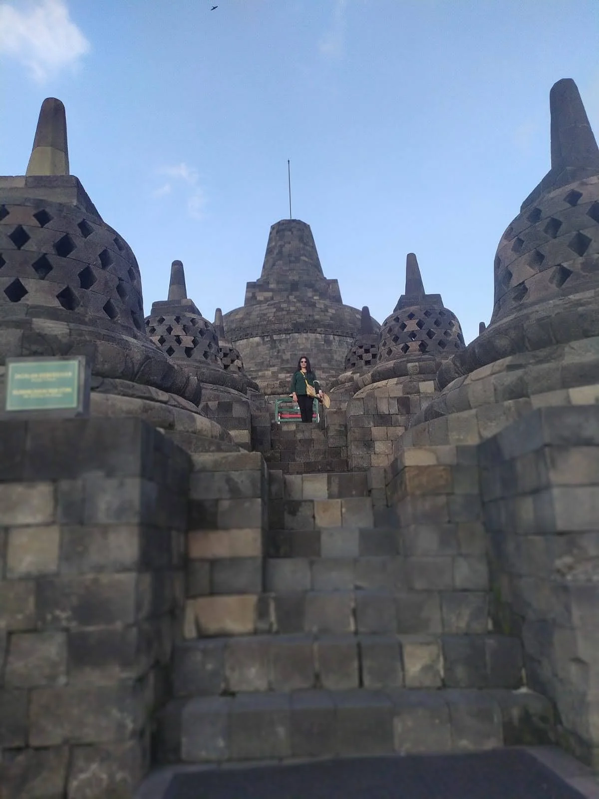 Traveler on central stairs leading to apex stupa at Borobudur