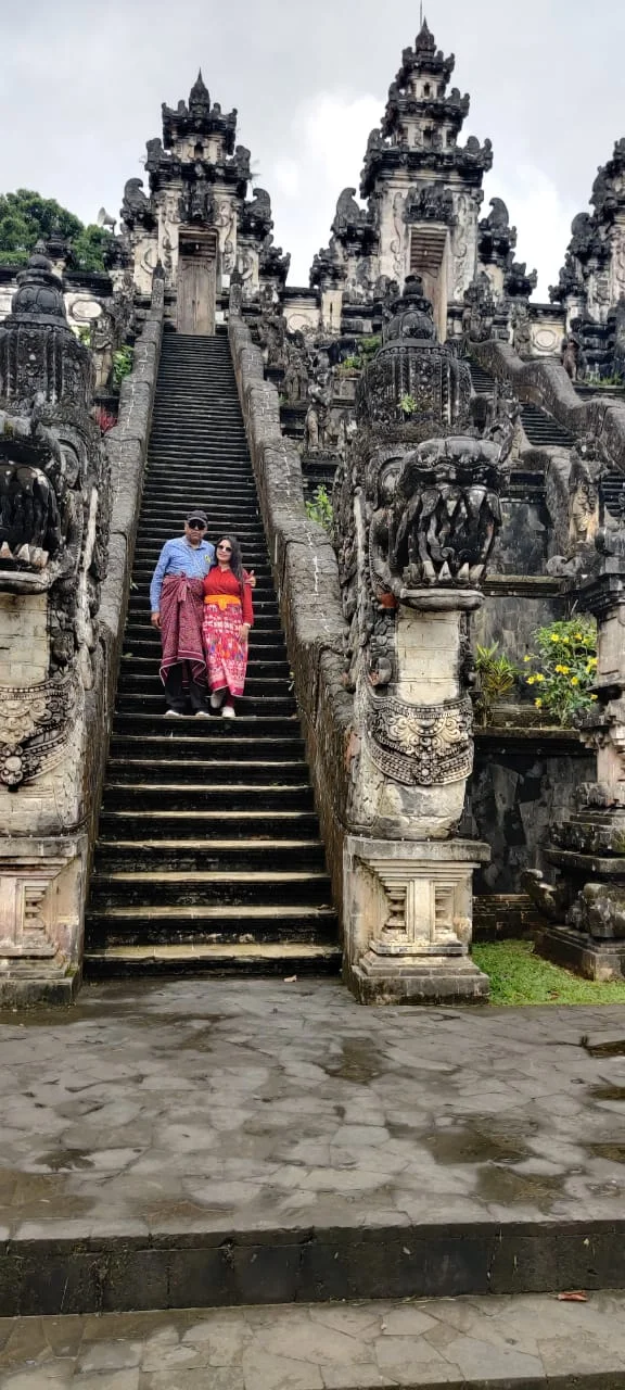 Both travelers together on the steep sacred staircase of Pura Lempuyang