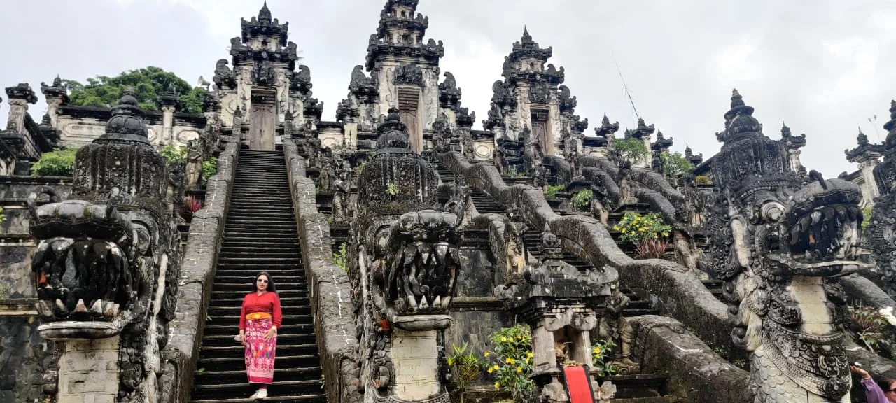 Panoramic view of the three ascending stone stairways flanked by carved Naga dragon serpents at Pura Penataran Agung Lempuyang