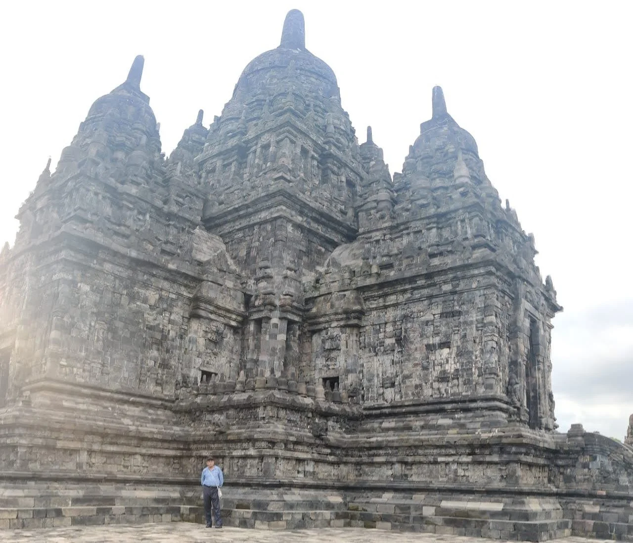 Traveler standing before the grand central sanctuary of Candi Sewu Buddhist complex
