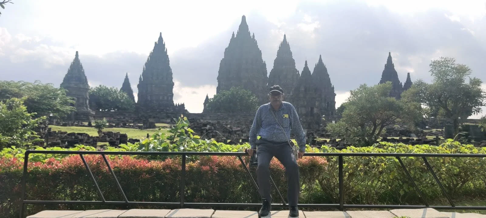 Traveler before the soaring Prambanan temple compound in Central Java