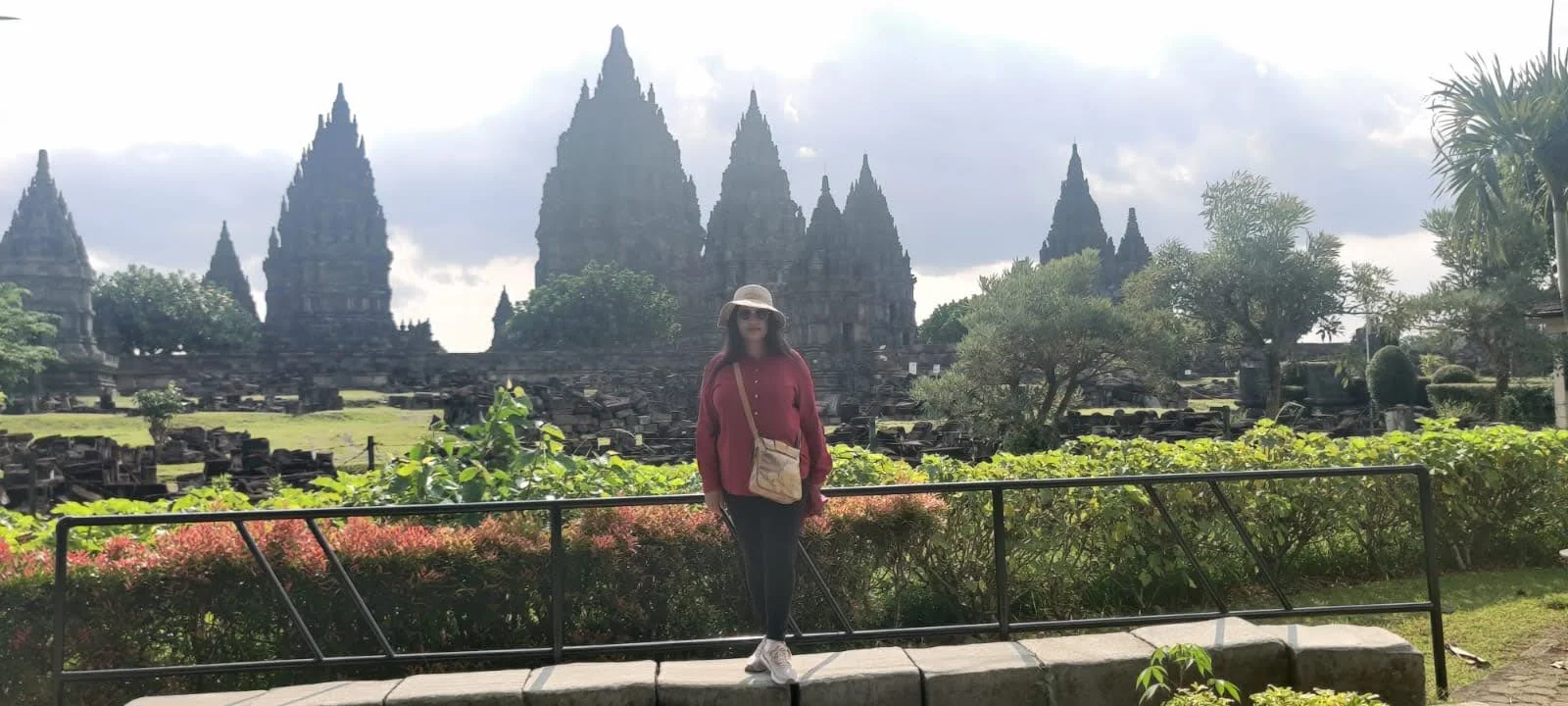 Shaded green pathways and tropical lawns surrounding Prambanan complex
