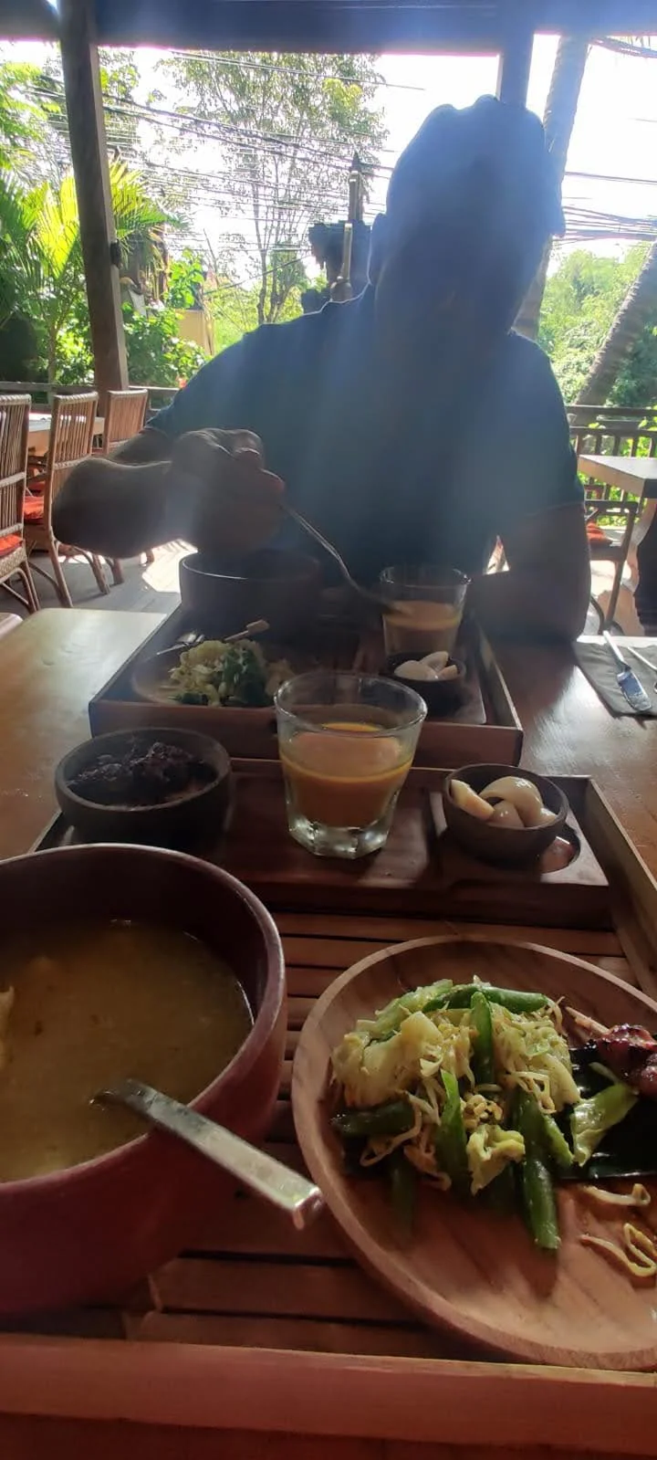 Authentic Balinese lunch feast with Sayur Urap, Sate Lilit, soup, fiery Sambal, and golden Jamu drink