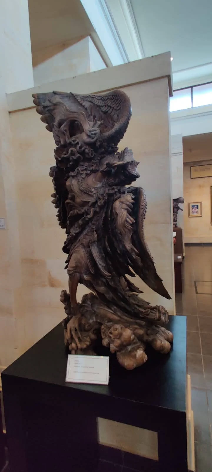 Magnificent hardwood carving of Lord Vishnu riding the mythical bird Garuda at Museum Puri Lukisan