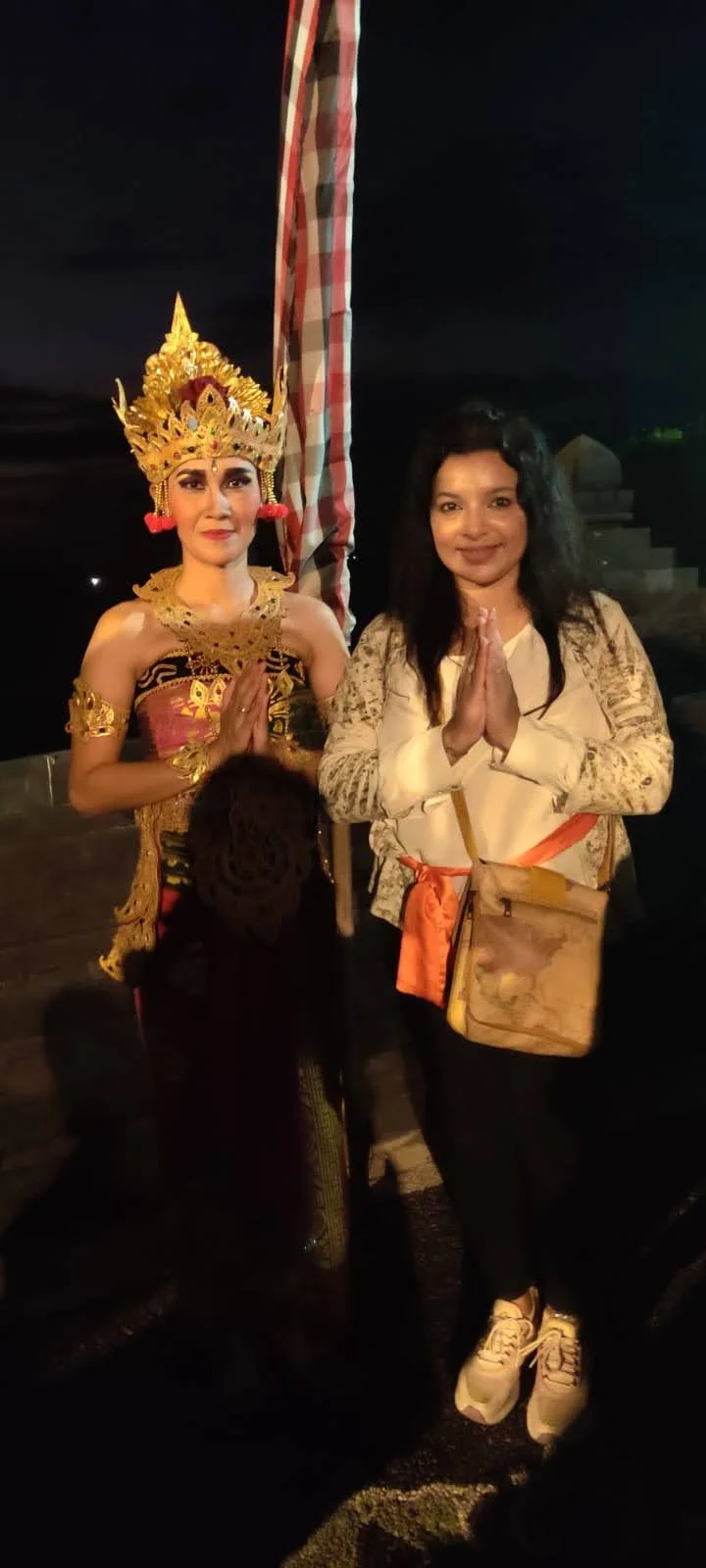 Classical Balinese dancer in opulent golden headdress portraying Dewi Sita