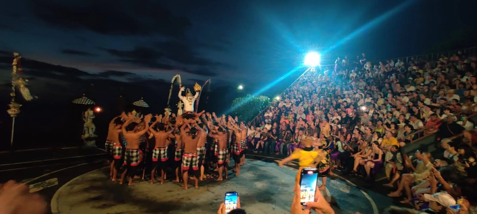Hanuman kicking burning coconut husks during the dramatic fire climax of the Kecak dance