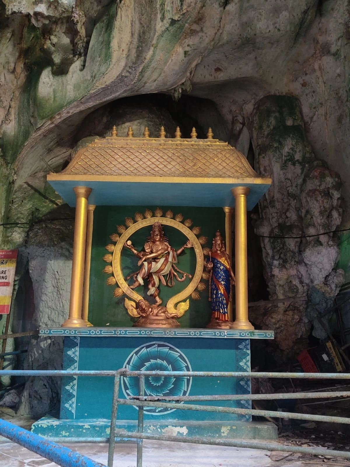 Sacred rock niche in the limestone wall enshrining Lord Nataraja performing the cosmic dance of creation and dissolution