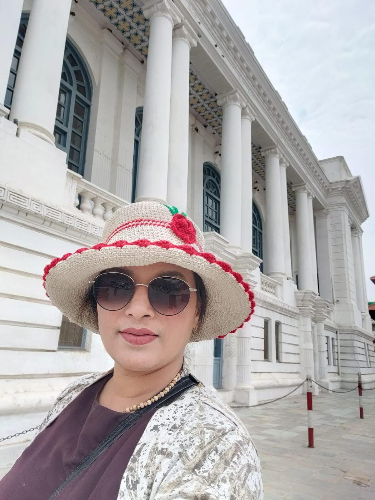 Neoclassical white facade of Gaddi Baithak with Corinthian columns and balustrades