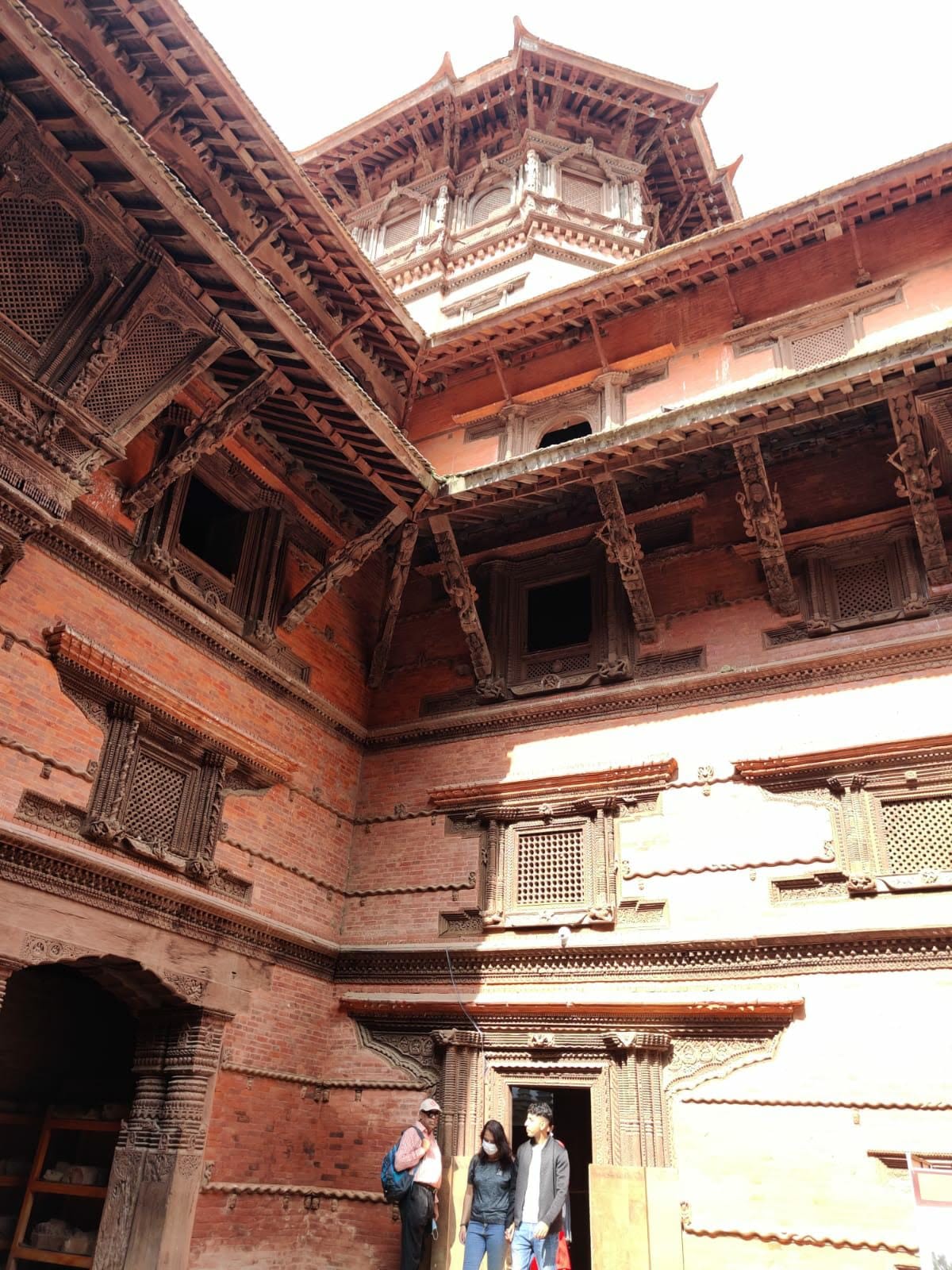 Inner courtyard of Nautalle Durbar looking up at the high wooden cornices and Basantapur tower