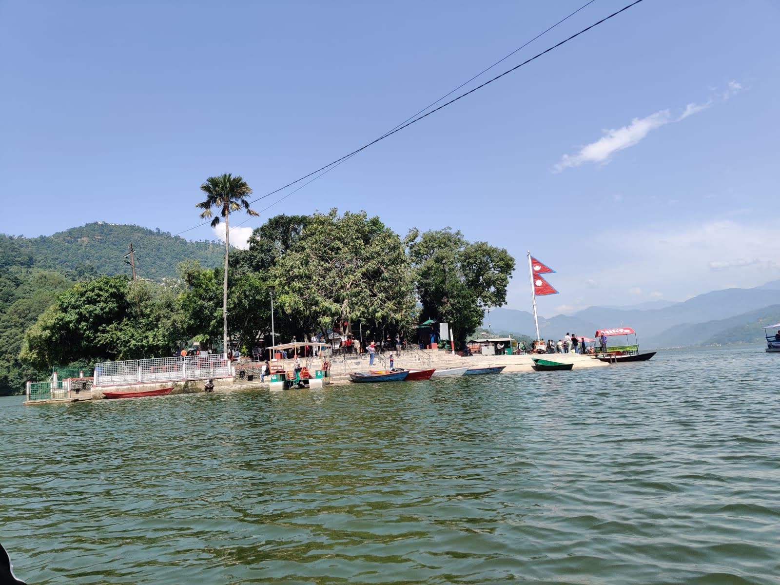 Tranquil waters of Phewa Lake leading to the sacred island of Tal Barahi Temple in Pokhara, Nepal