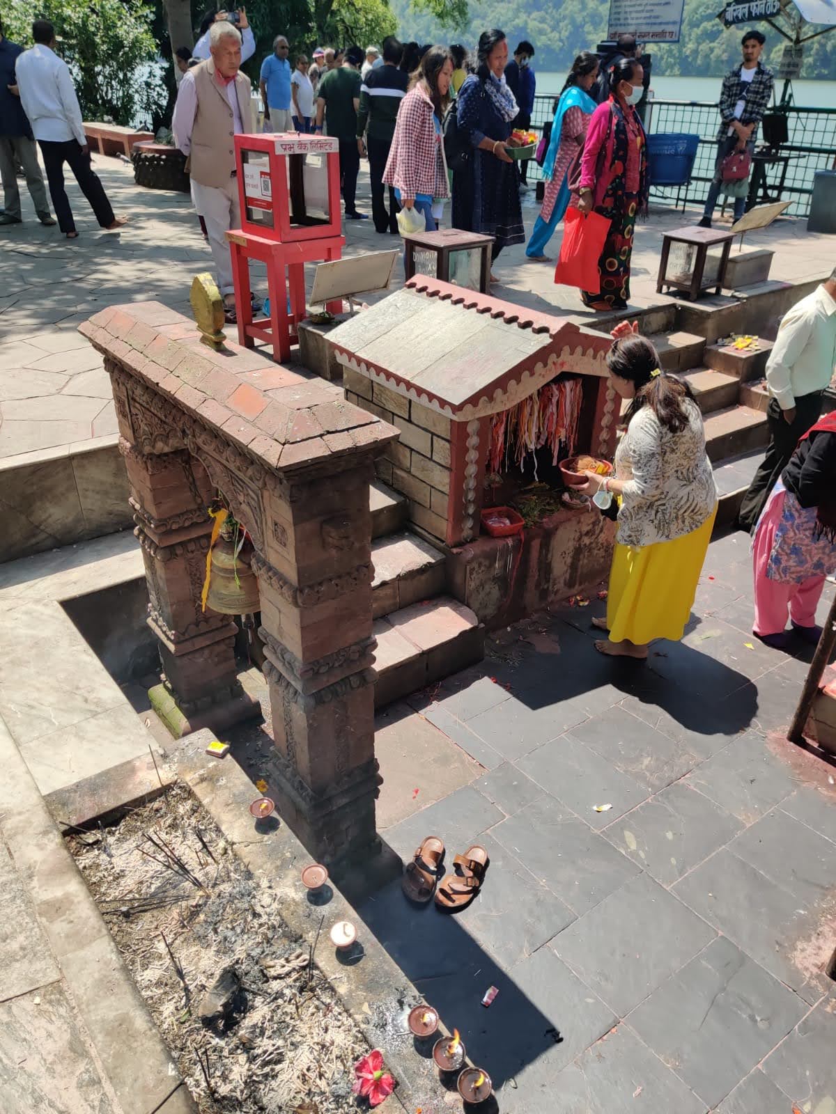Devotees offering prayers at Tal Barahi courtyard overlooking Phewa Lake