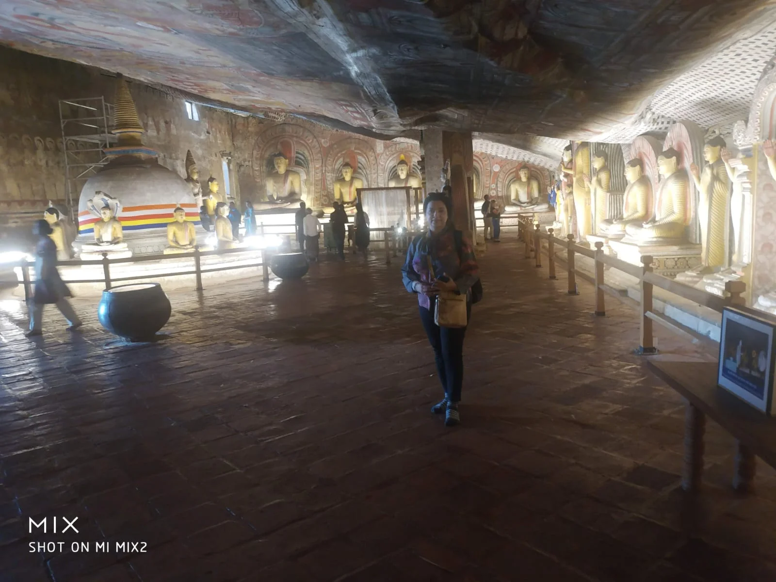 Inside Dambulla Cave 2 Maharaja Viharaya with interior stupa and rows of Buddha statues