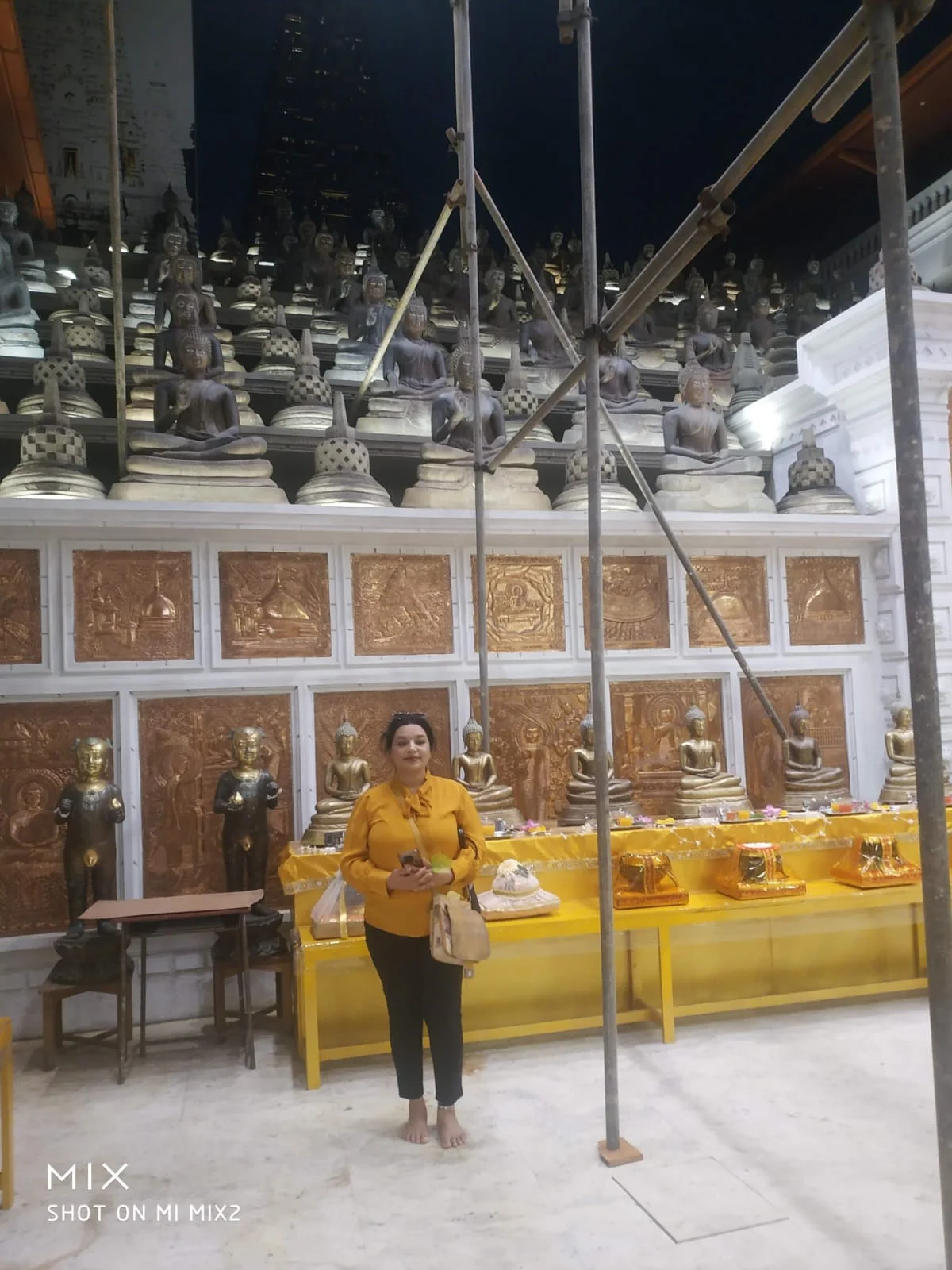 Historic Buddhist artifacts and antiquities inside the museum gallery of Gangaramaya Temple