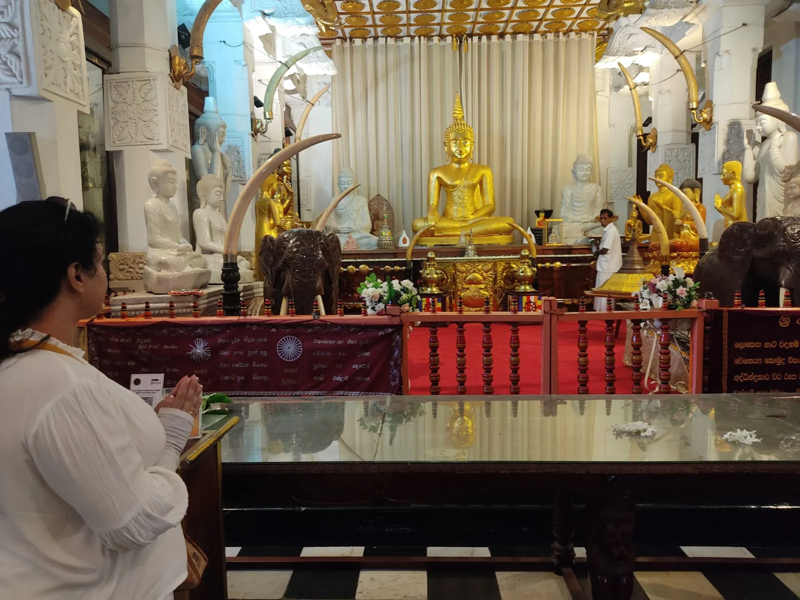 Gilded inner sanctum and flower offering table inside the Temple of the Sacred Tooth Relic
