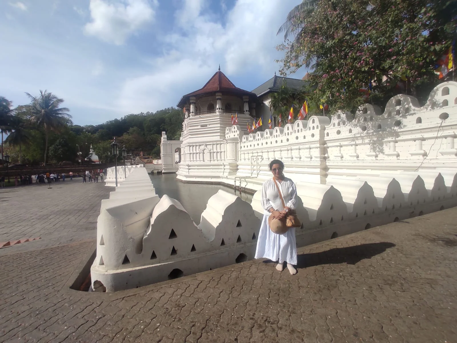 Temple of the Sacred Tooth Relic Sri Dalada Maligawa beside Kandy Lake with moat and cloud walls