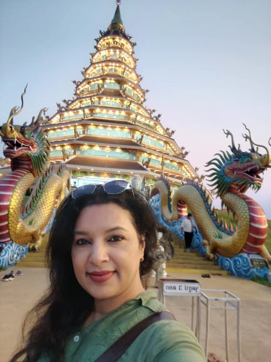 The 9-tiered pagoda of Wat Huay Pla Kang glowing warmly in the evening dusk