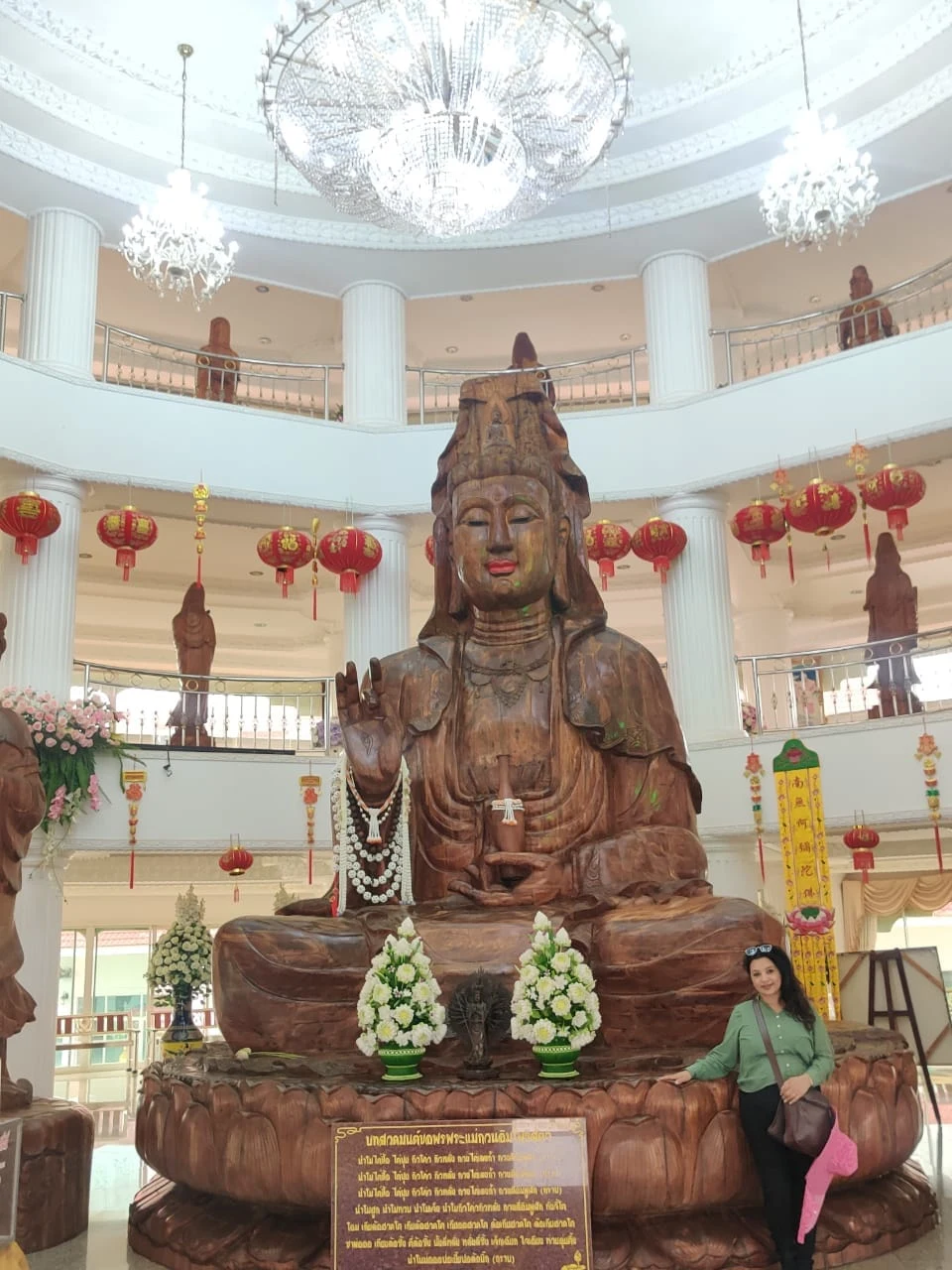 Intricately hand-carved teakwood Guan Yin Bodhisattva inside the pagoda
