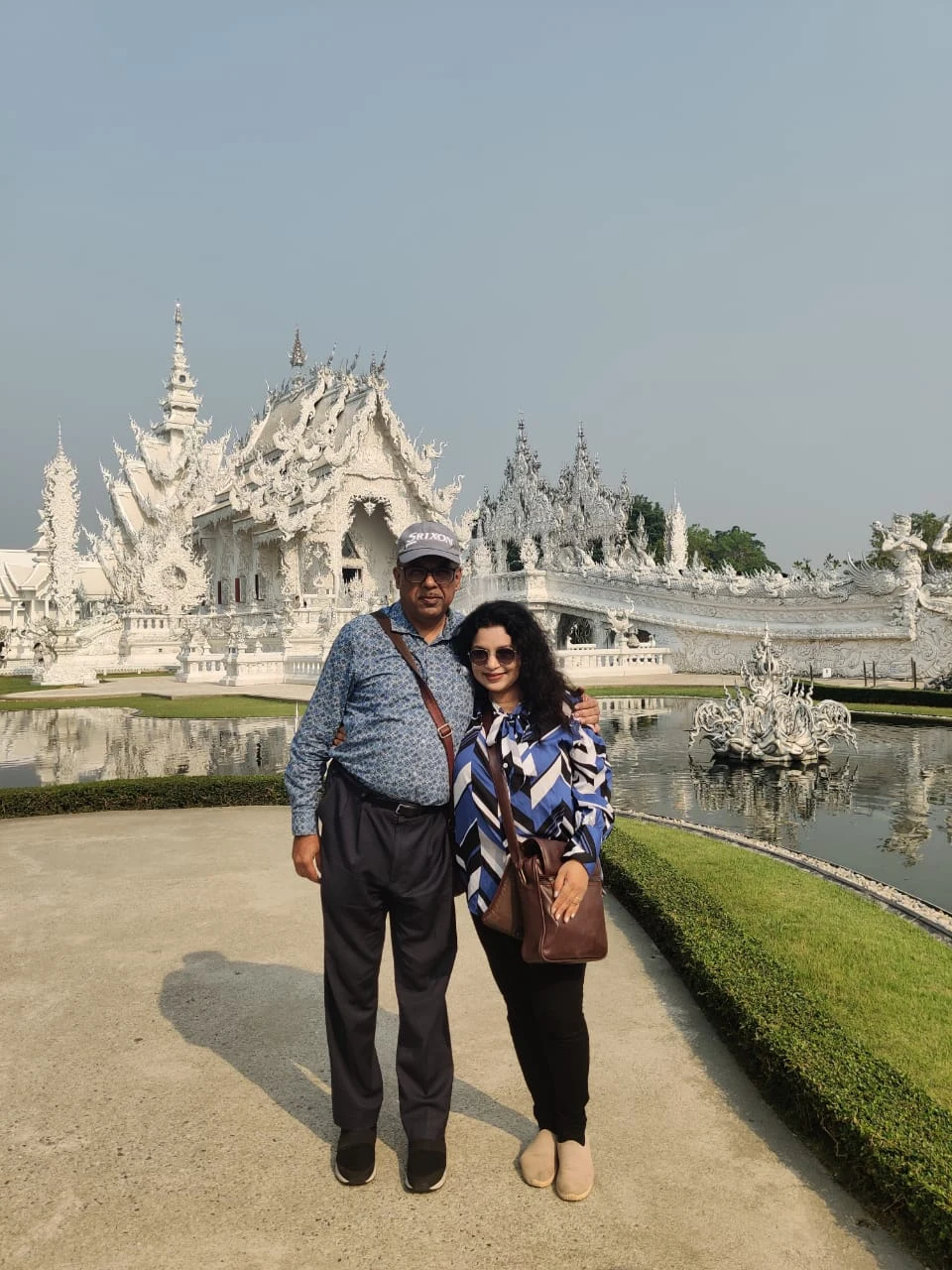 Wanderers at the pond in front of Wat Rong Khun (White Temple), Chiang Rai