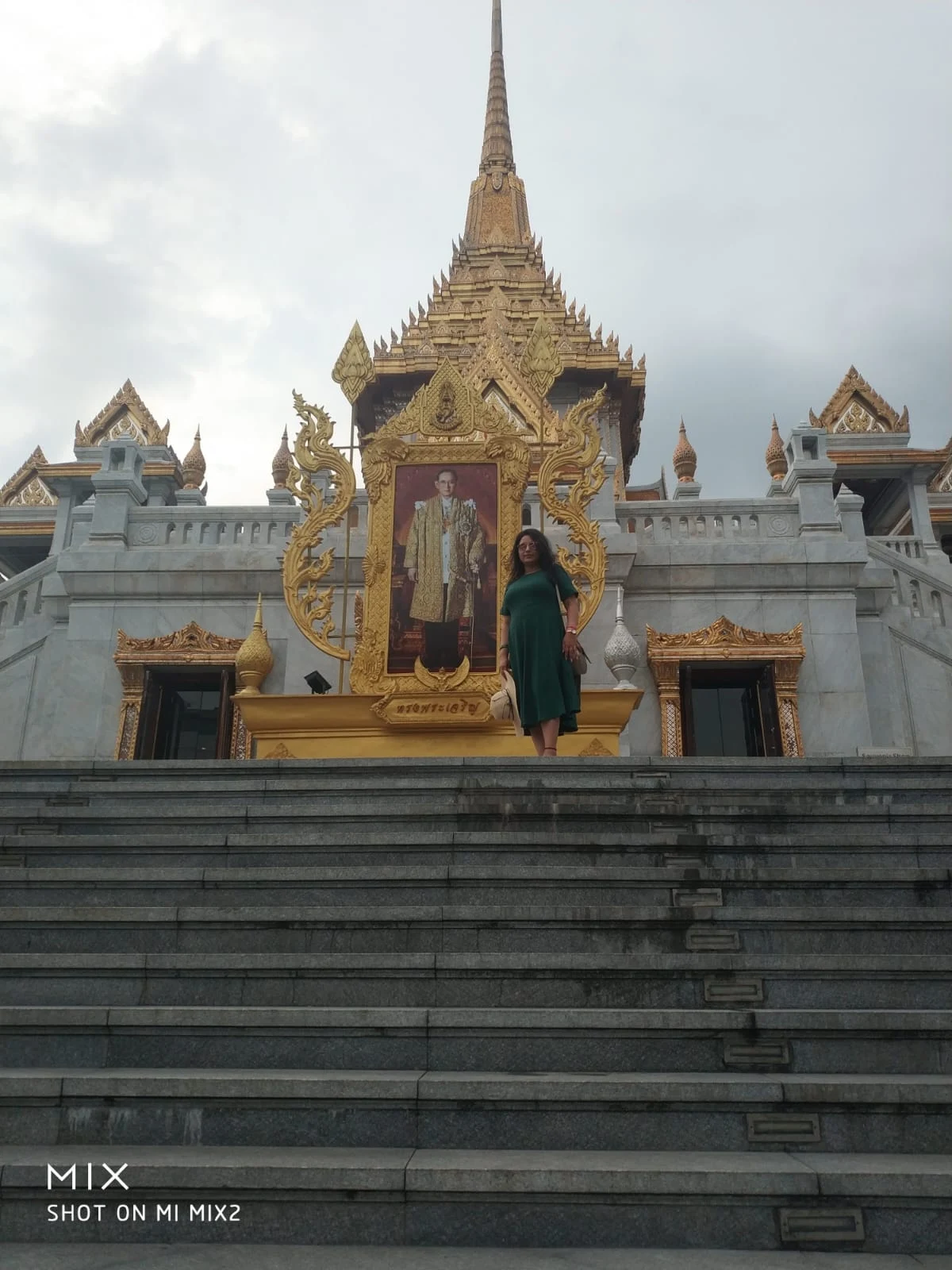 Grand staircase of Wat Traimit leading to the sanctuary with royal portrait of King Rama X