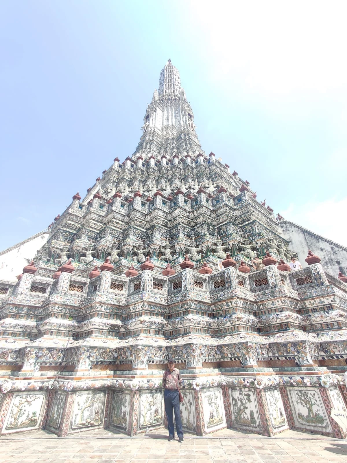 Base of the towering central prang at Wat Arun showing porcelain mosaics