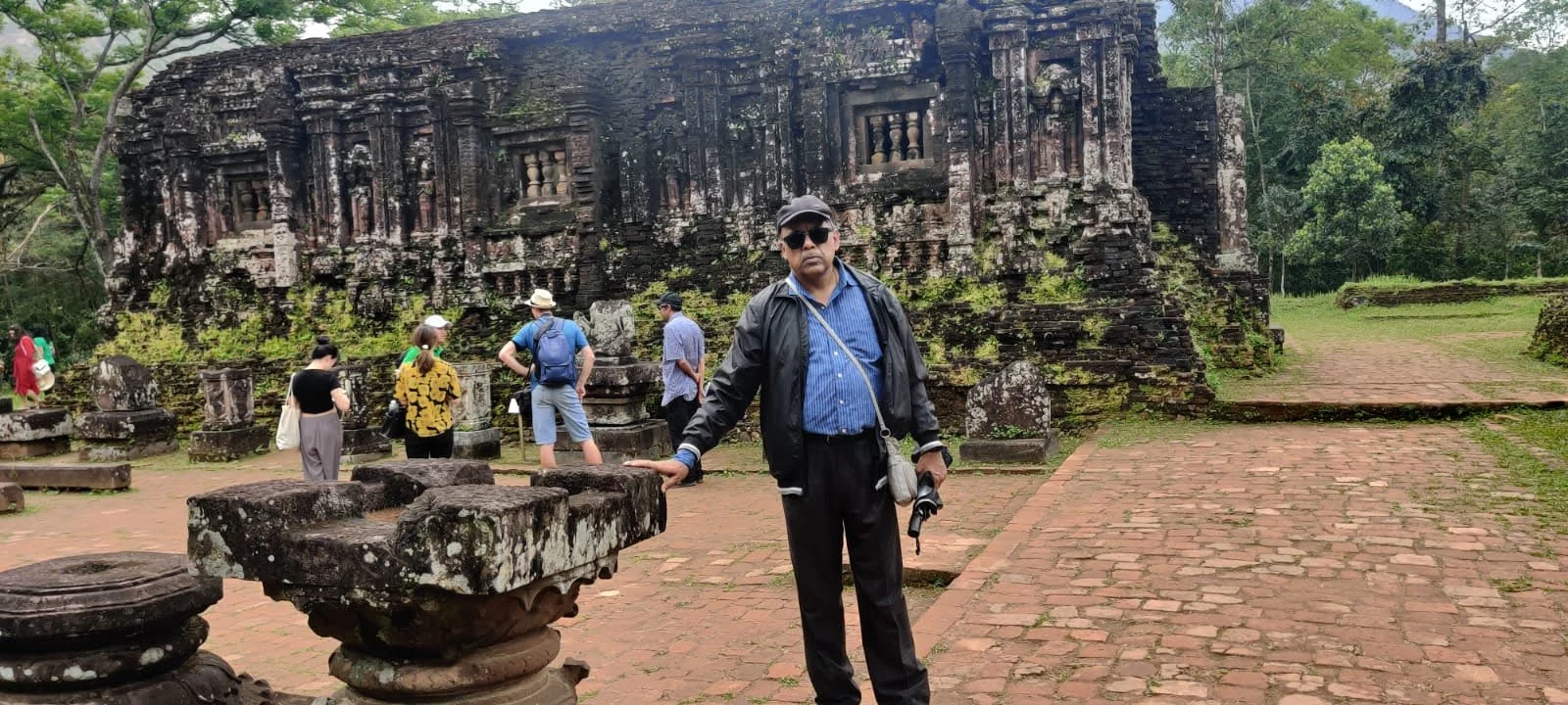 Traveler in the brick courtyard before the grand kalan tower of King Bhadravarman