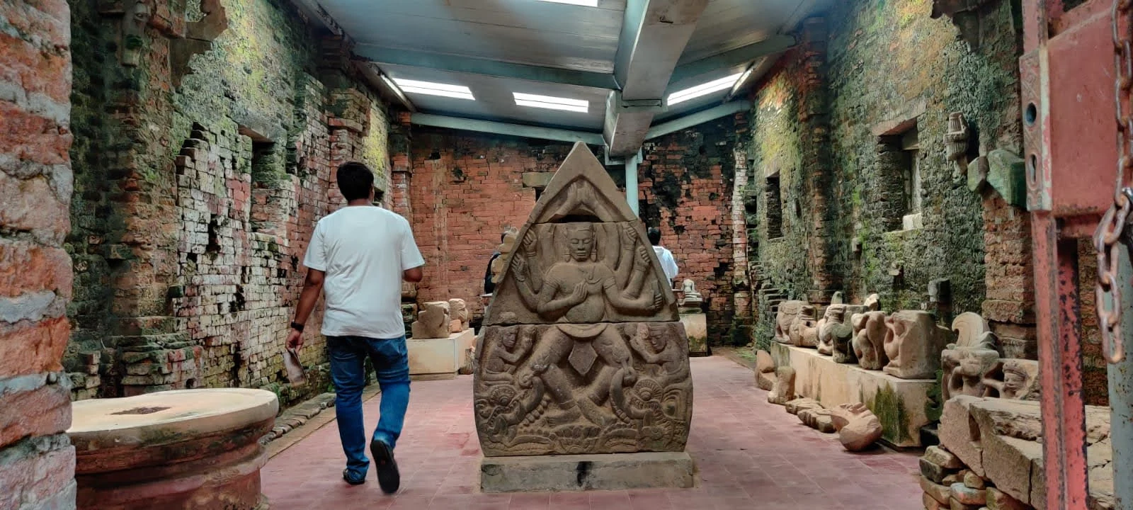 On-site museum exhibition displaying carved Shiva pediment and inscribed stones