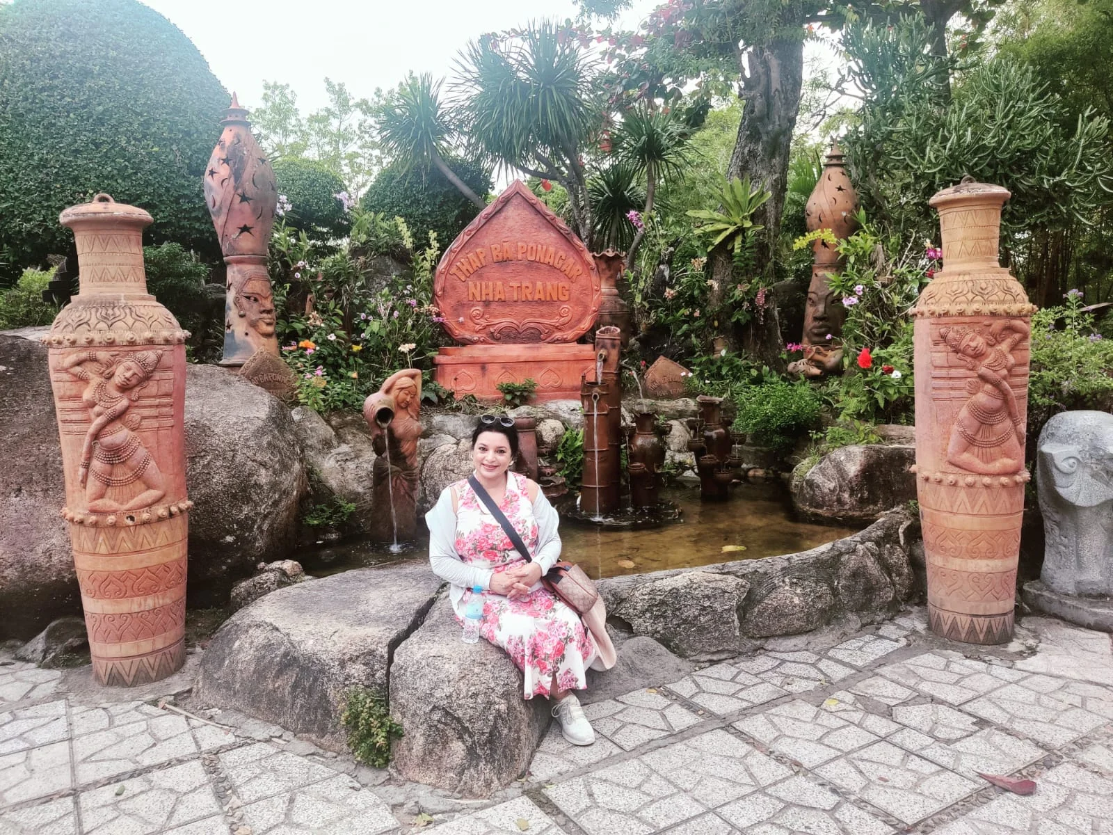 Flowers beside ancient stonework