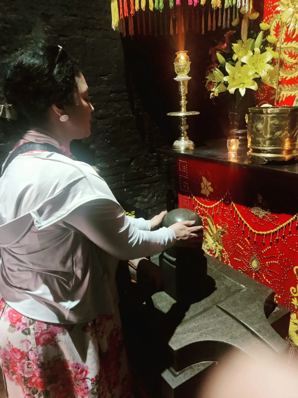 Shiva lingam sanctum with sacred offerings and prayers