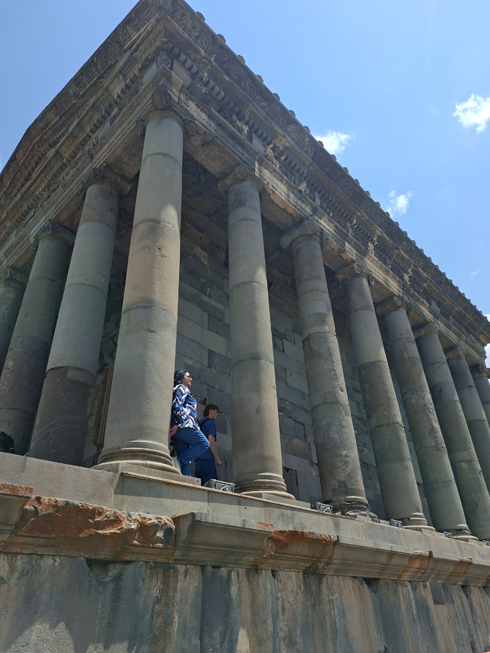 Symmetrical massive stone columns supporting Garni Temple roof