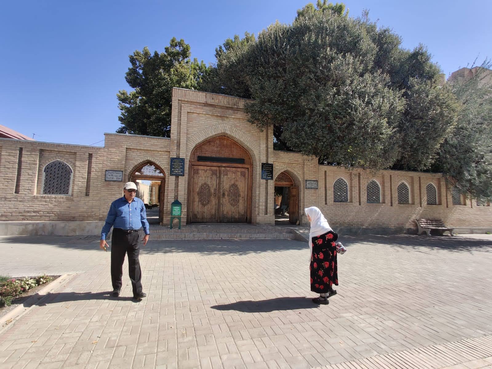 Scenic view of the mosque courtyard and surrounding brick walls