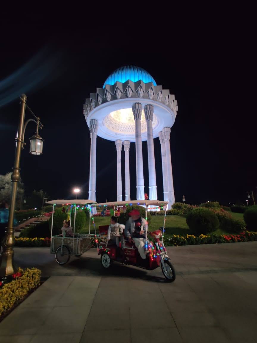 Brightly lit Tashkent streets and skyline at night