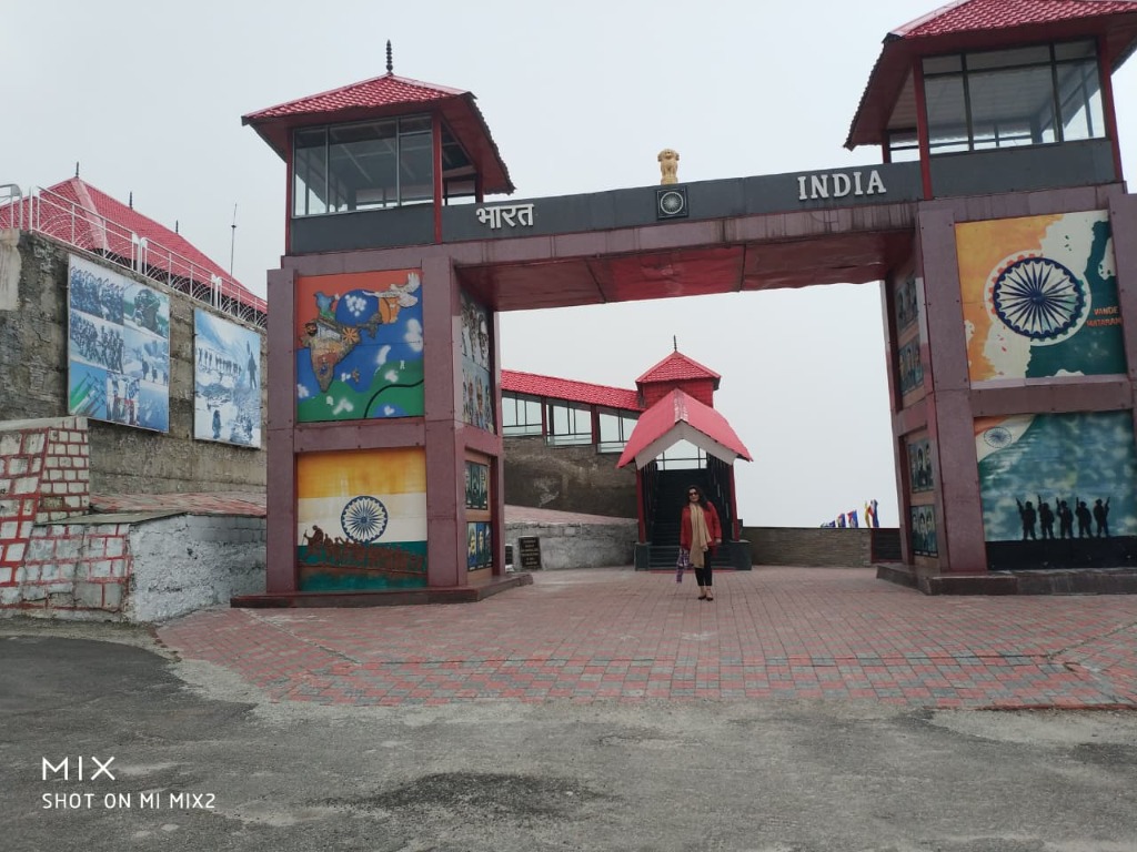 Traveler standing at Bharat India memorial gateway at Nathula Pass