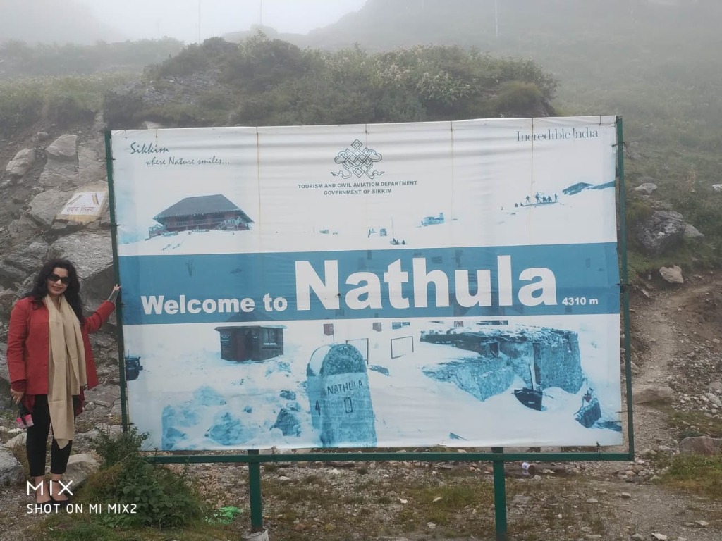 Traveler by Tourism Department Welcome to Nathula Pass 4310m signboard