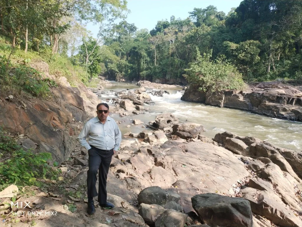 Exploring the rocky riverbed near Pobitora
